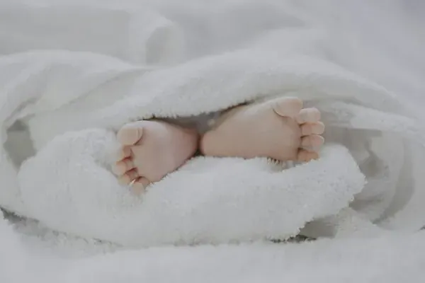Loving care for mother and newborn baby at home